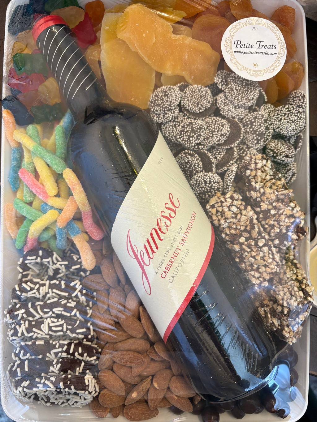 Rectangular tray with wine and confections